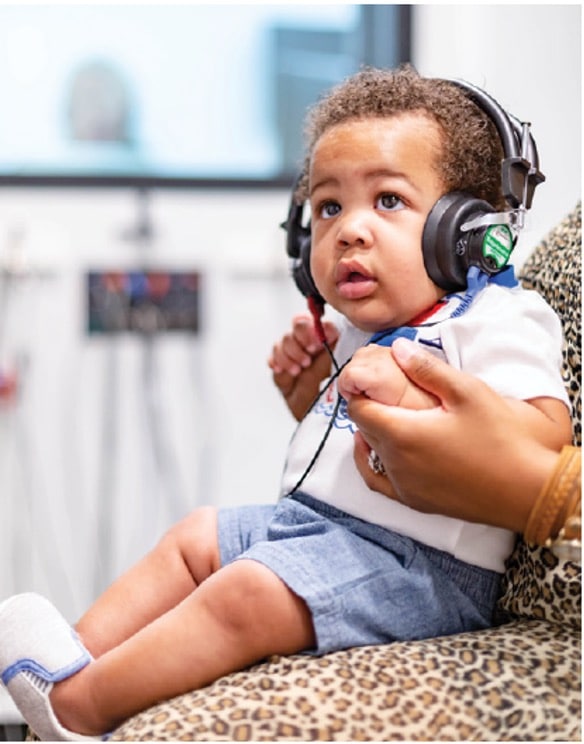 little boy with headphones