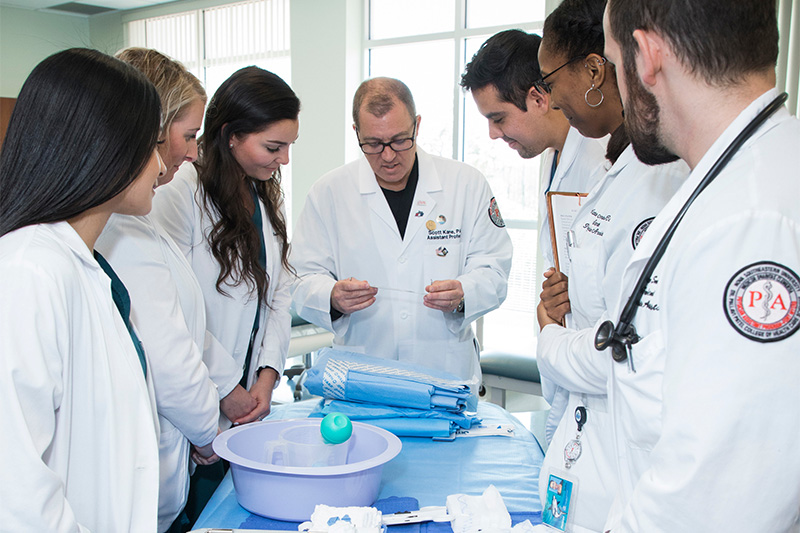 doctor teaching a group of physician assistant students